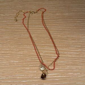 Elegant Gold and tangerine Layered Necklace with gold and faux pearl pendants.